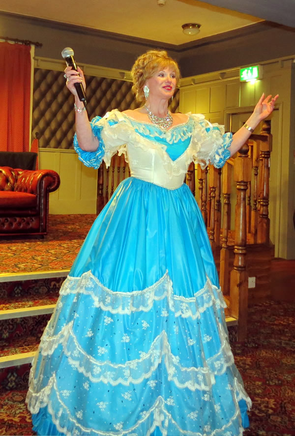 Image of me in blue with arms up