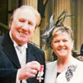 Duggie with Beryl colecting his MBE outside Buckingham Palace.