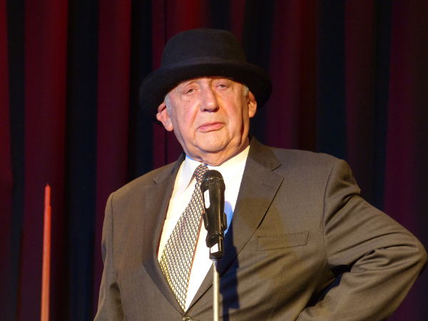 Freddie in hat on stage