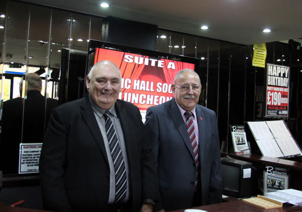 Eddie and Terry selling raffle tickets in the foyer of The Spot