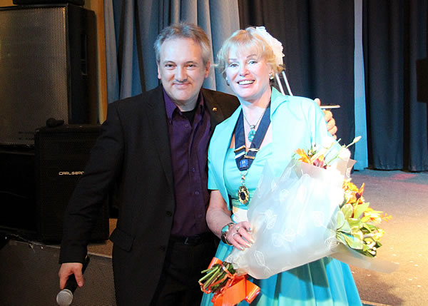  International Magician Andrew Van Buren presents flowers to Caroline